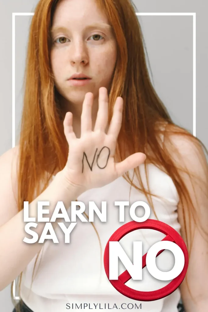 Woman with long red hair holding up her hand with the word “NO” written on her palm, with text reading “Learn to Say No,” symbolizing confidence, self-respect, and setting healthy boundaries.