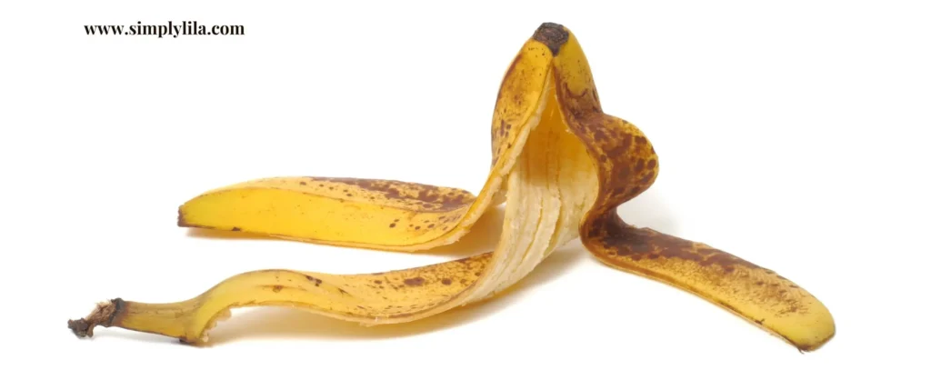 Ripe banana peel opened on white background